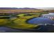 Aerial view of a pristine golf course featuring water features and lush fairways at 11300 N Casa Dega Dr # 1005, Surprise, AZ 85388