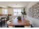 View of dining room featuring modern table, chairs, and stylish light fixtures at 11300 N Casa Dega Dr # 1005, Surprise, AZ 85388