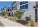 Contemporary home featuring an exterior design with decorative trees and plants at 11300 N Casa Dega Dr # 1005, Surprise, AZ 85388