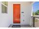 Close-up of the orange front door with visible address number and a small porch at 11300 N Casa Dega Dr # 1005, Surprise, AZ 85388