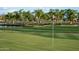 Scenic golf course with lush green grass, pond, and manicured landscaping at 11300 N Casa Dega Dr # 1005, Surprise, AZ 85388