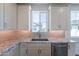 Updated kitchen featuring white cabinets, granite countertops, and stainless steel appliances at 11300 N Casa Dega Dr # 1005, Surprise, AZ 85388