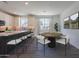 Eat-in kitchen featuring stainless appliances, stone countertops, and seating for four at 11300 N Casa Dega Dr # 1005, Surprise, AZ 85388
