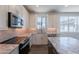Modern kitchen featuring granite countertops, stainless steel appliances, and a tile backsplash at 11300 N Casa Dega Dr # 1005, Surprise, AZ 85388