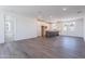 Open floor plan showcases the modern kitchen with a gray island and wood flooring at 11300 N Casa Dega Dr # 1005, Surprise, AZ 85388