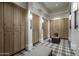 Spacious locker room with wood lockers, seating, and modern lighting for convenience at 11300 N Casa Dega Dr # 1005, Surprise, AZ 85388