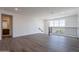 Bright loft area with wood-look floors, neutral walls, and a glimpse of a bathroom at 11300 N Casa Dega Dr # 1005, Surprise, AZ 85388