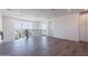 Loft area featuring hardwood floors, bright light and railing with black balusters at 11300 N Casa Dega Dr # 1005, Surprise, AZ 85388