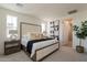 Serene main bedroom with a upholstered headboard, soft lighting, and stylish decor at 11300 N Casa Dega Dr # 1005, Surprise, AZ 85388