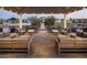 Inviting outdoor lounge area with comfortable sofas and manicured landscaping at 11300 N Casa Dega Dr # 1005, Surprise, AZ 85388