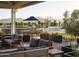 Inviting outdoor lounge area with comfortable sofas and manicured landscaping at 11300 N Casa Dega Dr # 1005, Surprise, AZ 85388