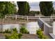 Community pond with a white fence and landscaping at 11300 N Casa Dega Dr # 1005, Surprise, AZ 85388