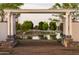 Charming view of a pond and gardens from a pergola, creating a tranquil and inviting outdoor atmosphere at 11300 N Casa Dega Dr # 1005, Surprise, AZ 85388