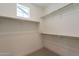 Spacious walk-in closet with ample shelving and hanging space for optimal storage at 11300 N Casa Dega Dr # 1005, Surprise, AZ 85388
