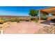 Charming backyard featuring desert landscaping, and brick patio at 11669 W Pine Mountain Ct, Surprise, AZ 85378
