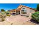 Inviting outdoor space with mature landscaping, brick patio and desert views at 11669 W Pine Mountain Ct, Surprise, AZ 85378