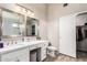 Bathroom featuring double vanity, modern fixtures, and glass enclosed shower at 11669 W Pine Mountain Ct, Surprise, AZ 85378