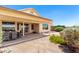 Outdoor patio with a lush desert landscape and covered dining at 11669 W Pine Mountain Ct, Surprise, AZ 85378