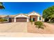 Charming single-story home featuring a three-car garage, desert landscaping, and a well-maintained front yard at 1710 S Aaron --, Mesa, AZ 85209