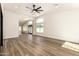 Expansive living area features wood floors, fresh paint, many windows, and lots of natural light at 1710 S Aaron --, Mesa, AZ 85209