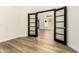 Home office featuring wood floors, fresh paint, and a stylish glass paned door at 1710 S Aaron --, Mesa, AZ 85209
