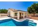 Inviting backyard featuring a sparkling pool, covered patio, and low maintenance landscaping at 1710 S Aaron --, Mesa, AZ 85209