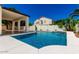 Beautiful backyard oasis showcasing a sparkling pool, covered patio, and water feature with mature trees at 1710 S Aaron --, Mesa, AZ 85209