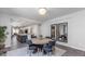 Open-concept dining area with view to the kitchen and stylish decor with modern mirrors at 17178 W Buchanan St, Goodyear, AZ 85338
