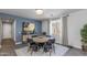 Chic dining room featuring stylish chairs, a modern table, and sophisticated decor at 17178 W Buchanan St, Goodyear, AZ 85338
