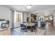 Well-lit dining area with modern table and chairs, open to kitchen and living space at 17178 W Buchanan St, Goodyear, AZ 85338