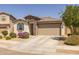 Charming single-story home featuring stone accents, desert landscaping, and a two-car garage at 17178 W Buchanan St, Goodyear, AZ 85338