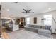 Open-concept living space combining the living room and kitchen with modern finishes and abundant natural light at 17178 W Buchanan St, Goodyear, AZ 85338