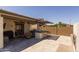 Patio with an outdoor kitchen and fireplace at 17178 W Buchanan St, Goodyear, AZ 85338