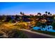 Stunning aerial view of the neighborhood at dusk, featuring a waterway and lush landscape at 1724 W Blue Ridge Way, Chandler, AZ 85248