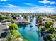 An aerial view of waterfront houses nestled in a neighborhood with lush landscaping and blue waterways at 1724 W Blue Ridge Way, Chandler, AZ 85248