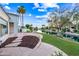 Beautiful backyard with a waterway view and stone patio at 1724 W Blue Ridge Way, Chandler, AZ 85248