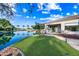 Backyard oasis with lush lawn, access to lake, perfect for relaxation and outdoor enjoyment at 1724 W Blue Ridge Way, Chandler, AZ 85248