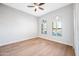 Bedroom with wood floors, arched windows and ceiling fan at 1724 W Blue Ridge Way, Chandler, AZ 85248