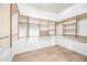 Well-organized walk-in closet with custom shelving and ample storage space at 1724 W Blue Ridge Way, Chandler, AZ 85248