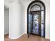 Elegant front door with decorative wrought iron and textured glass accents welcomes you to the home at 1724 W Blue Ridge Way, Chandler, AZ 85248