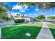 Charming home with lush landscaping, mature trees, and a well-manicured front yard at 1724 W Blue Ridge Way, Chandler, AZ 85248