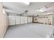 Spacious three car garage with storage and epoxy floors at 1724 W Blue Ridge Way, Chandler, AZ 85248