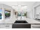 Kitchen island featuring a farmhouse sink, chandelier lighting and views of the lake at 1724 W Blue Ridge Way, Chandler, AZ 85248