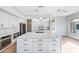 Modern kitchen with stainless appliances, large kitchen island with bar seating, and stylish pendant lighting at 1724 W Blue Ridge Way, Chandler, AZ 85248