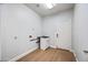 Functional laundry room with utility sink, storage, and exterior door at 1724 W Blue Ridge Way, Chandler, AZ 85248