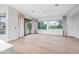 Open and airy living room with expansive windows offering stunning views of the lake and backyard at 1724 W Blue Ridge Way, Chandler, AZ 85248