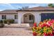 Inviting front entrance with arched entryway, fresh landscaping, and a well-maintained facade at 1800 W Shawnee Dr, Chandler, AZ 85224