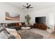 Cozy living room featuring a large sectional sofa, stylish decor, and a large TV at 1800 W Shawnee Dr, Chandler, AZ 85224