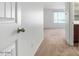 View from the hall into a bright bedroom with carpet at 18514 W Williams Rd, Surprise, AZ 85387
