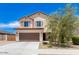 Charming two-story home featuring a two-car garage and desert landscaping at 18514 W Williams Rd, Surprise, AZ 85387
